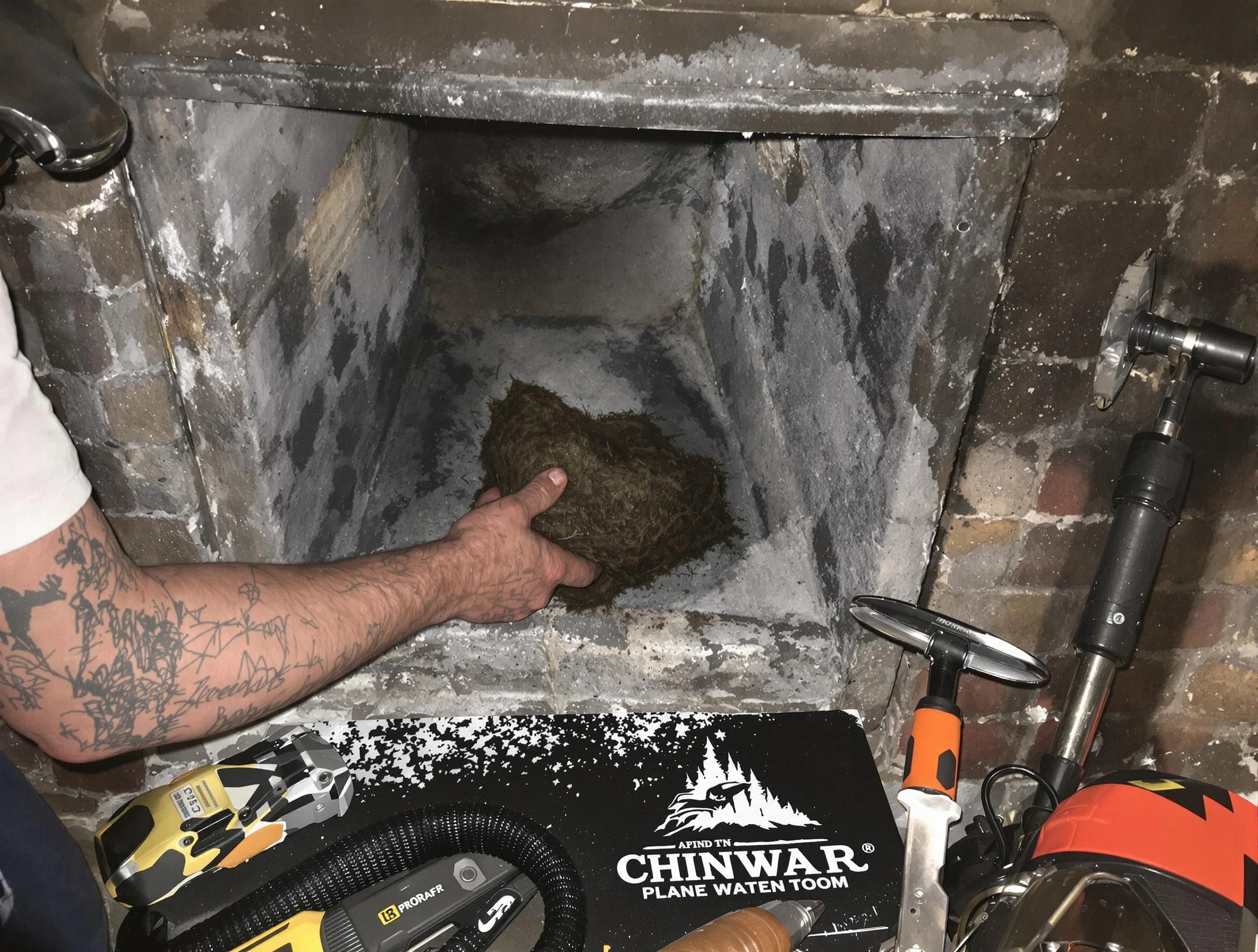 Beverly Chimney Sweep safely removing debris and screening chimney in Beverly, MA