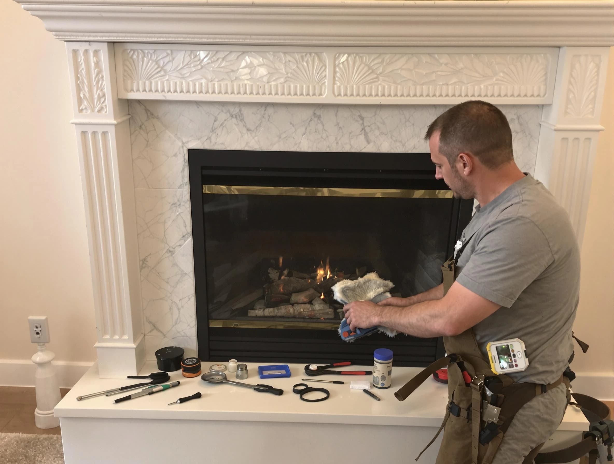 Beverly Chimney Sweep performing fireplace maintenance in Beverly, MA